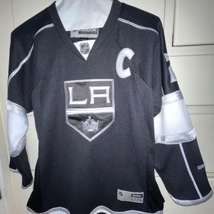 Official NHL Reebok LA Kings black hockey jersey size youth L/XL. Never worn.